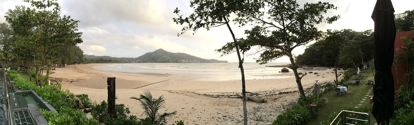 Kamala Beach and its bay seen through the trees