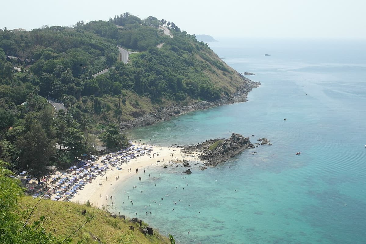 A sandy cove beneath the green headland at Nai Harn, in Phuket’s far south