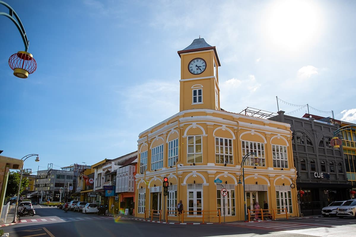 The yellow clock-tower building at a crossroads in Phuket Old Town