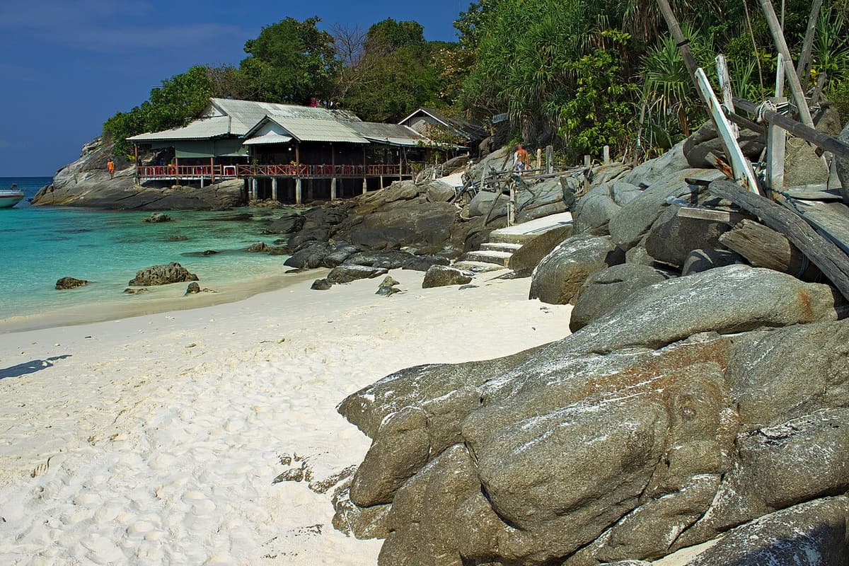 A white-sand beach with granite rocks on Racha Yai island