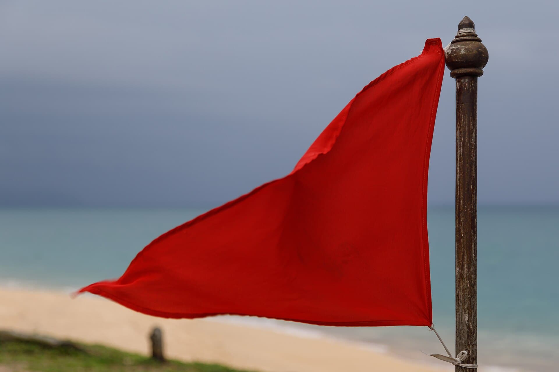 A red warning flag on a Phuket beach